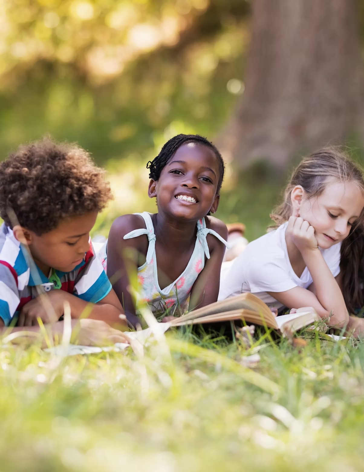 Children reading together, part of Learn to Earn Dayton's cradle-to-career mission